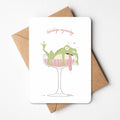 Illustratie van kikker in een champagneglas met een kater