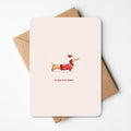 Schattige kerstkaart met een hondje, perfect voor het versturen van kerstgroeten aan vrienden en familie, met een speelse en vrolijke uitstraling voor de feestdagen.