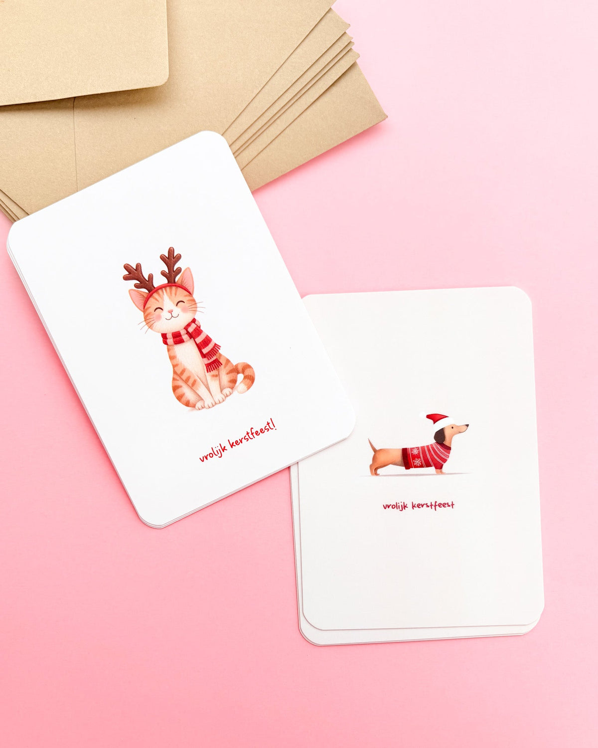 Set kerstkaarten met illustratie van hond en kat. 